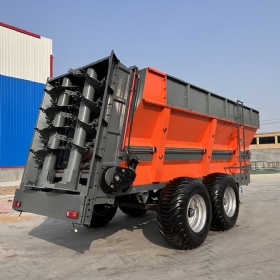 Hydraulic traction double vertical auger fertilizer spreader